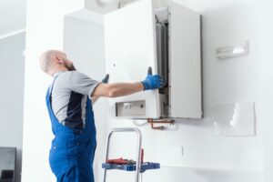 Technician installing boiler