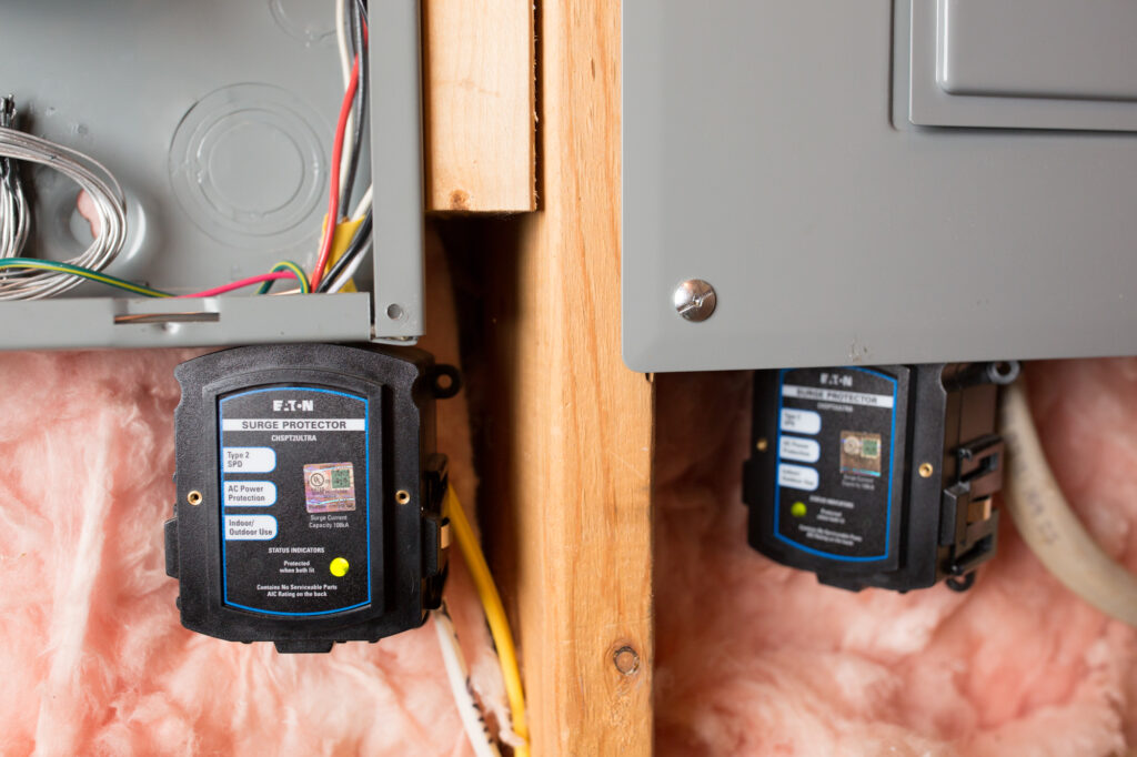 Two whole-house surge protectors installed with the main breaker system