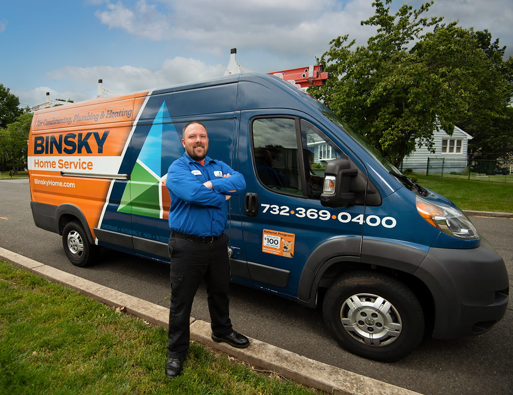 Binsky Technician in front of the Binsky Service Van